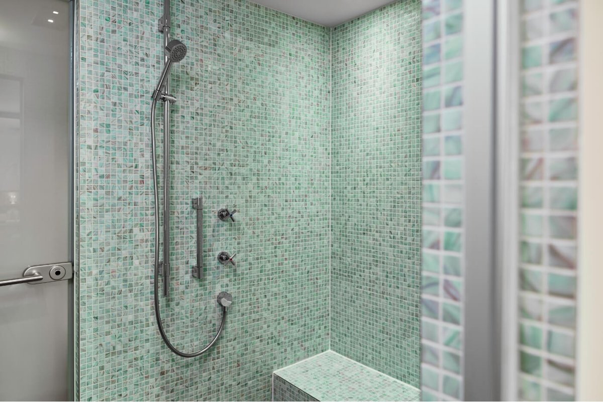 A turquoise tiled shower