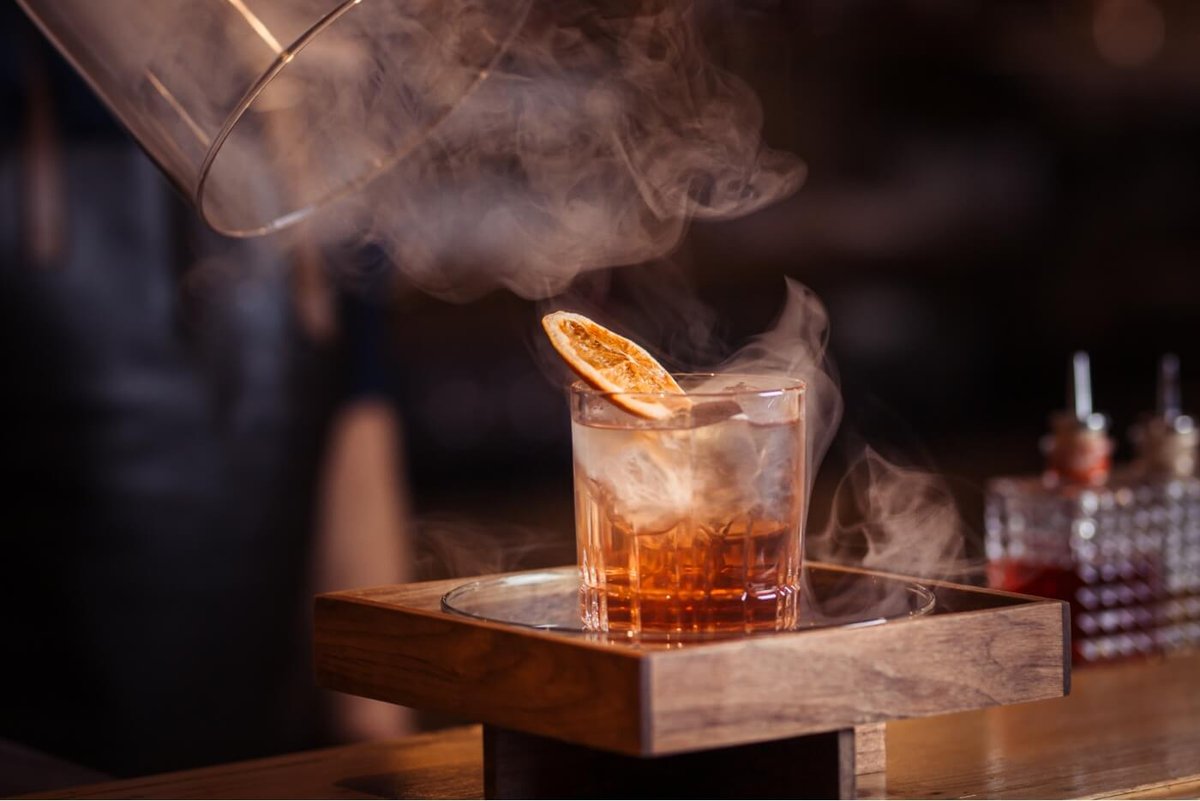 A cocktail served with smoke in the Cooper Bar & Lounge