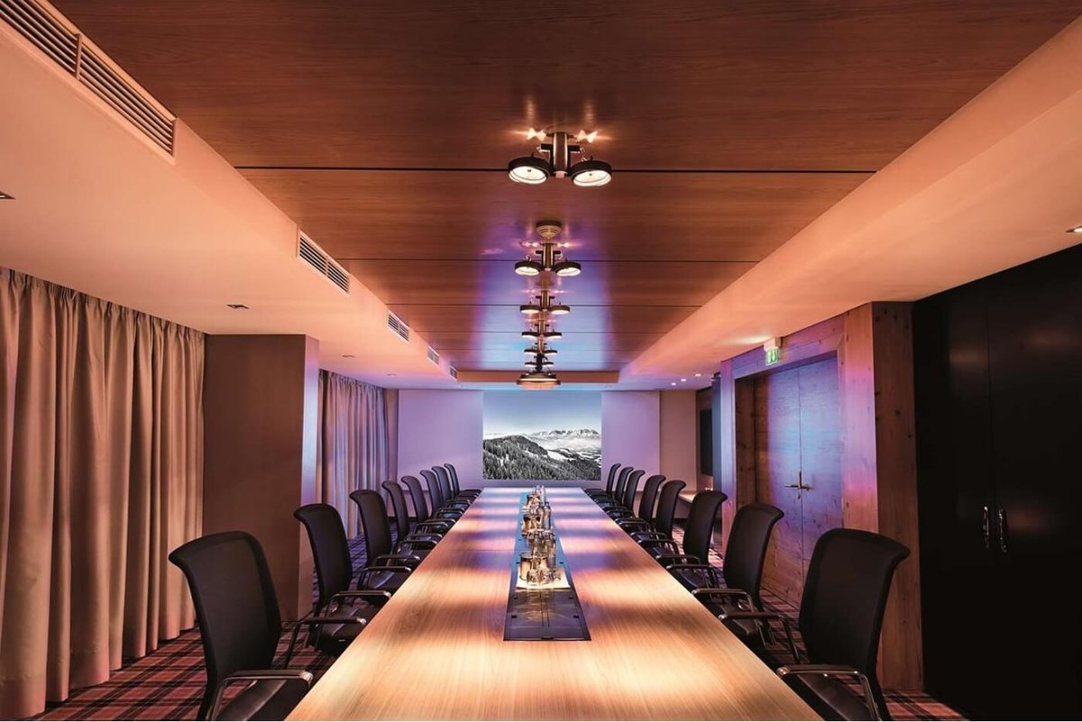 A long meeting room in cosy light