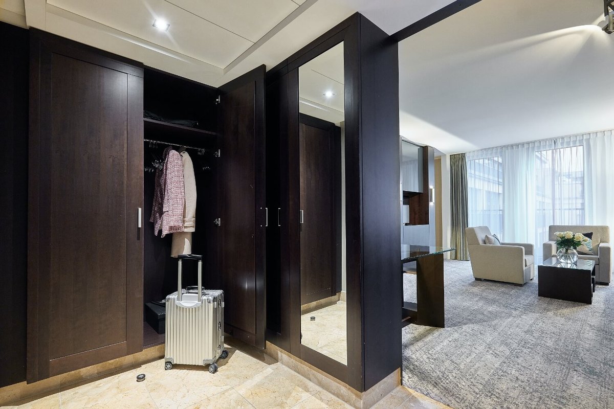 View of the entrance area with wardrobe of a Deluxe Suite
