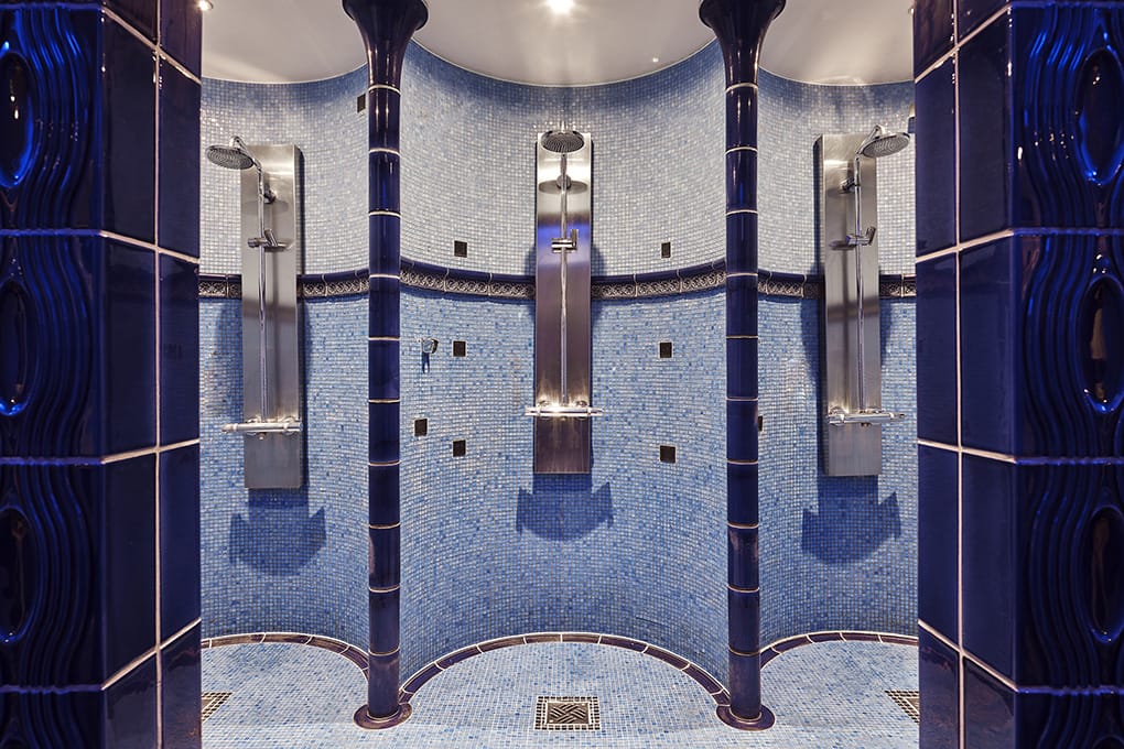 Shower niches with blue mosaic stones in the Beauty Spa of the Maison Messmer spa hotel Baden Baden
