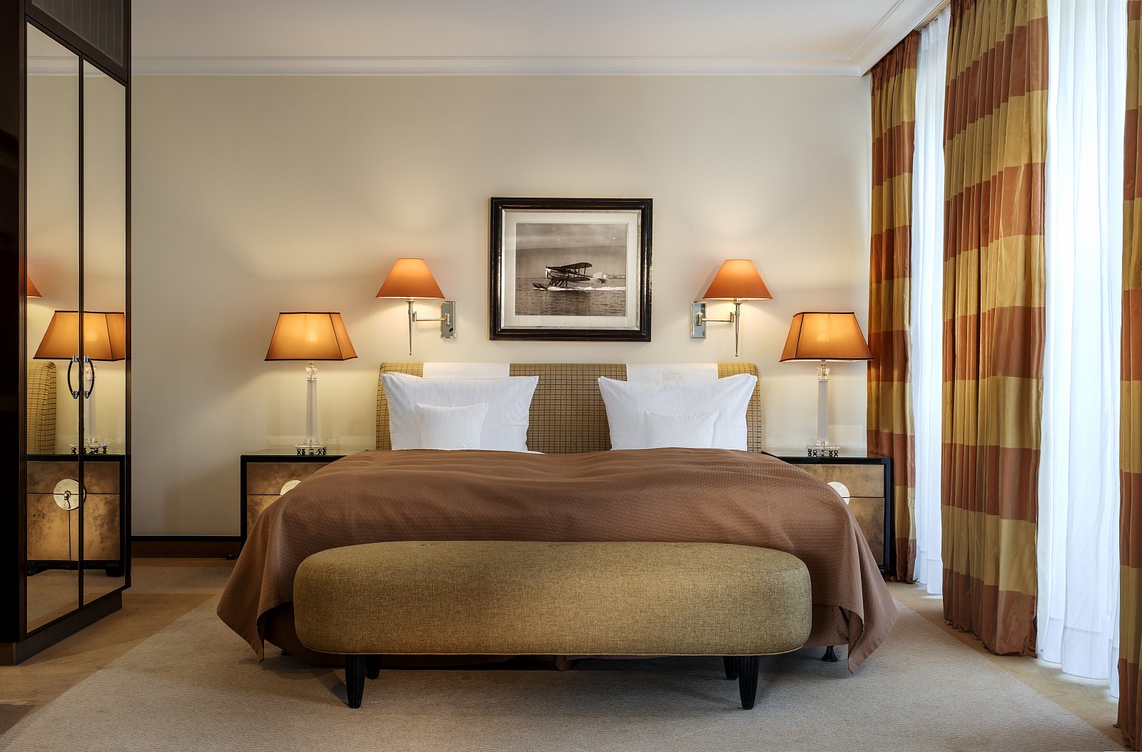Frontal view of a double bed of a superior suite of the hotel 
