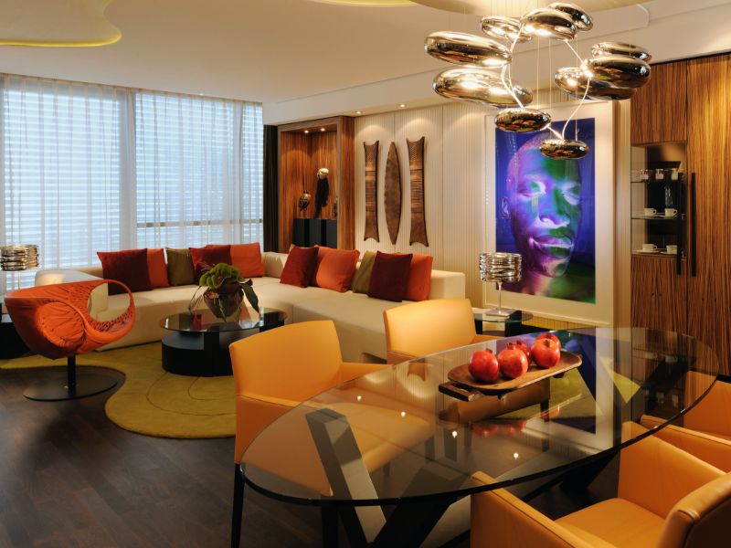 The large living and dining area of the Lifestyle Suite, a hotel room in Dusseldorf