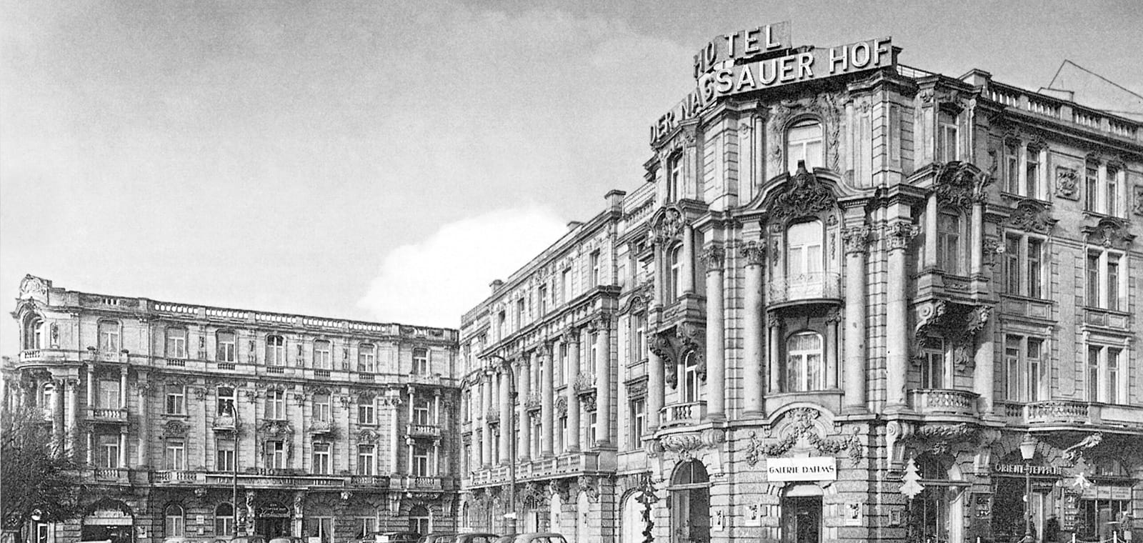 Black and white photo of the exterior of the hotel from the past 