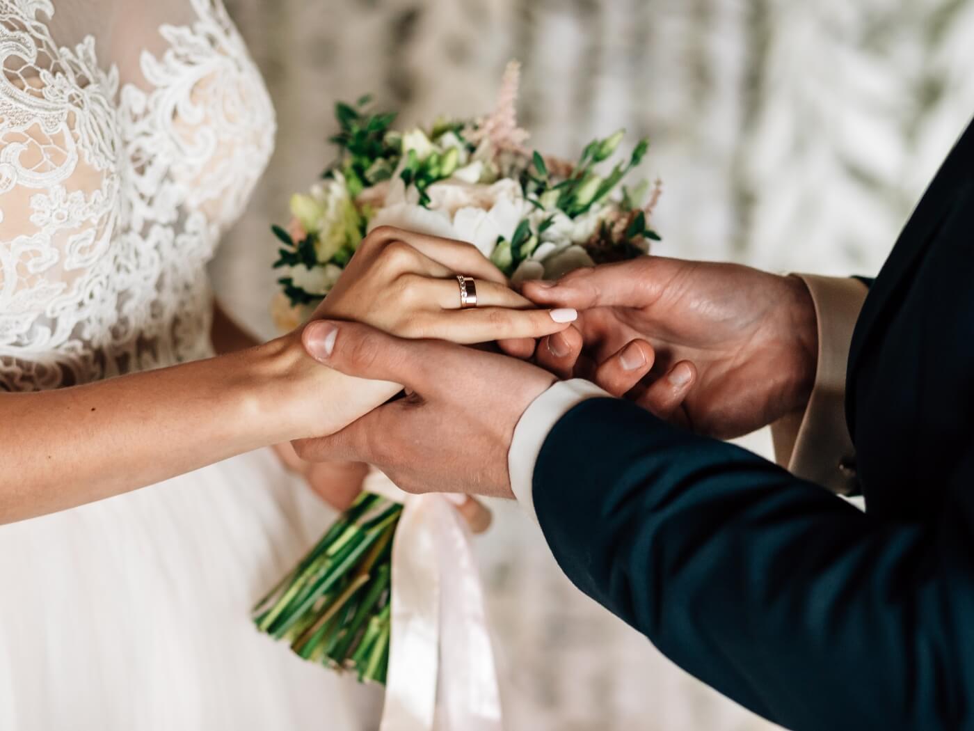 Close-up of hands of a wedding couple in the wedding venue in Austria