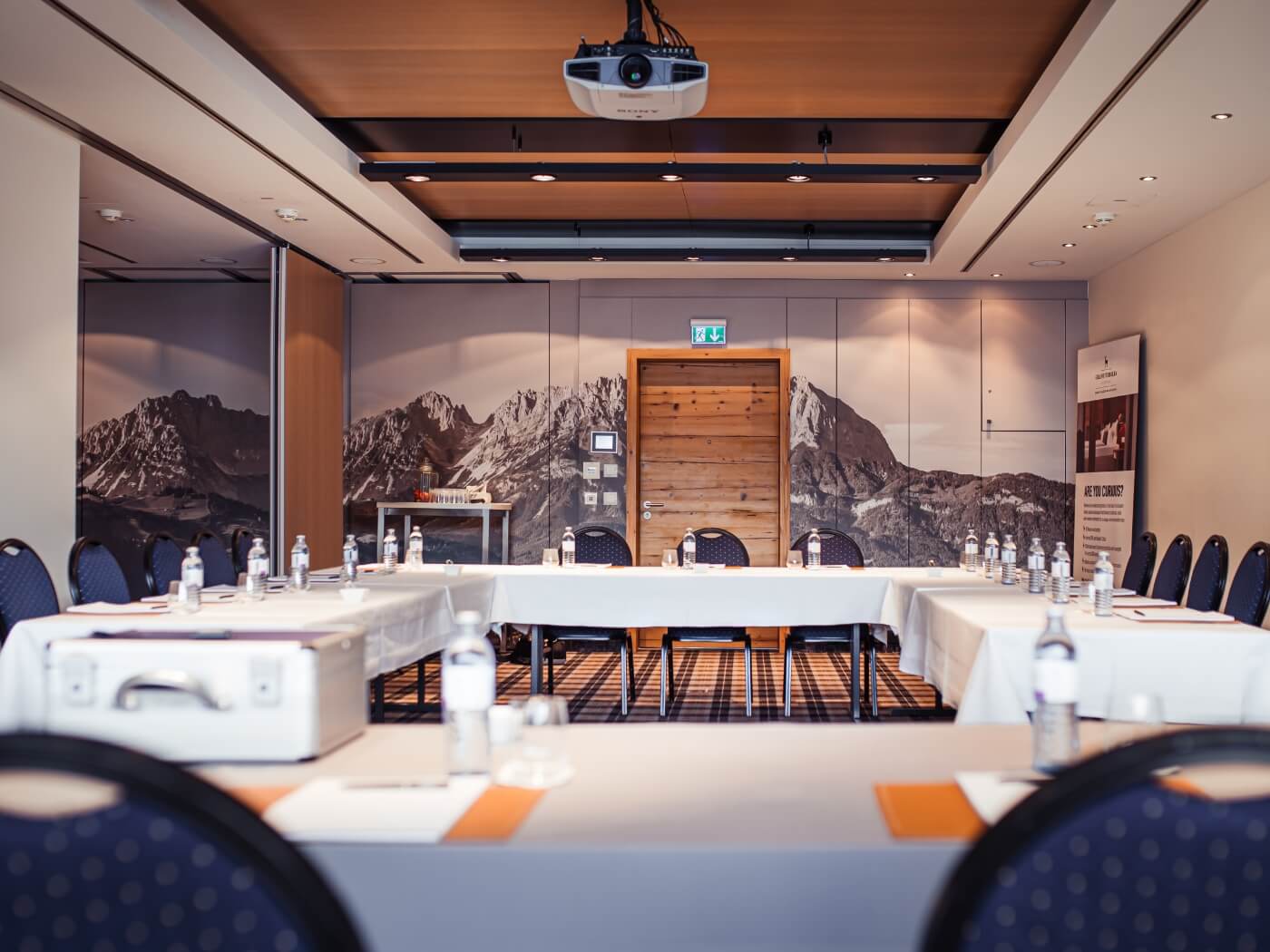 A meeting room with mountain panorama wallpaper at the conference hotel in Tyrol