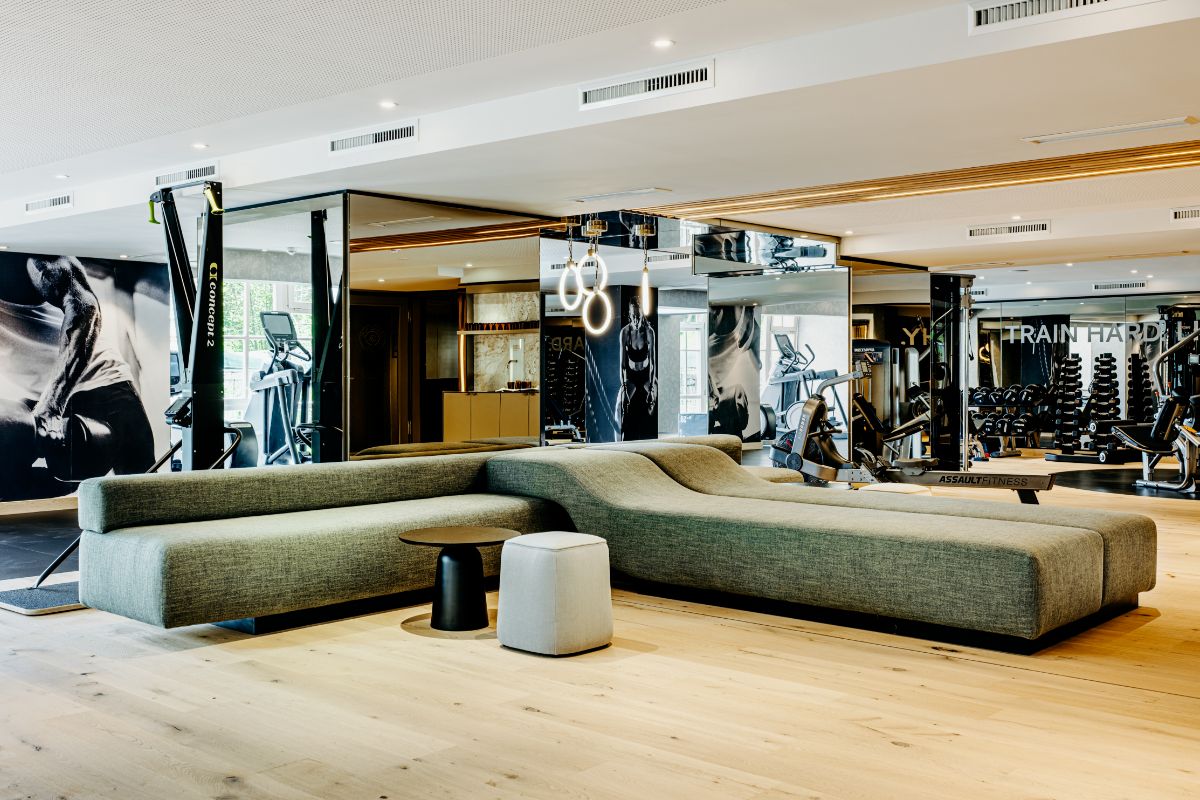 The Grand Alps Fitness with a variety of modern equipment and a stylish seating area